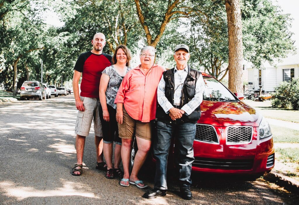 Family at the electric car